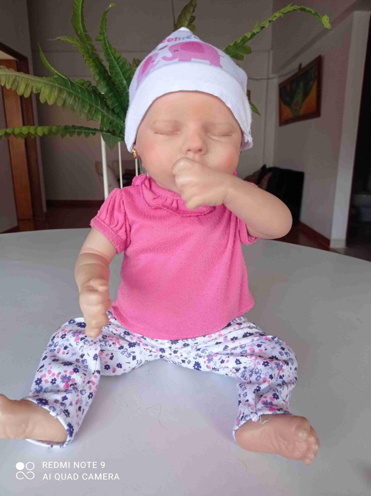 Muñeca Reborn con accesorios y ropa, foto 6 de 7
