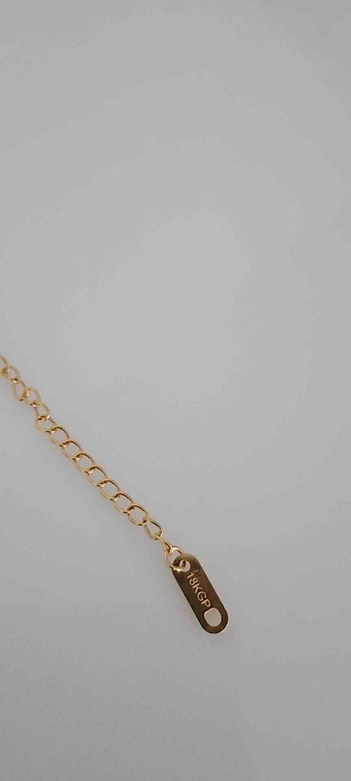 Pulsera doble cara trébol negro y pedrería acero inoxidable y baño de oro 18k, foto 5 de 5