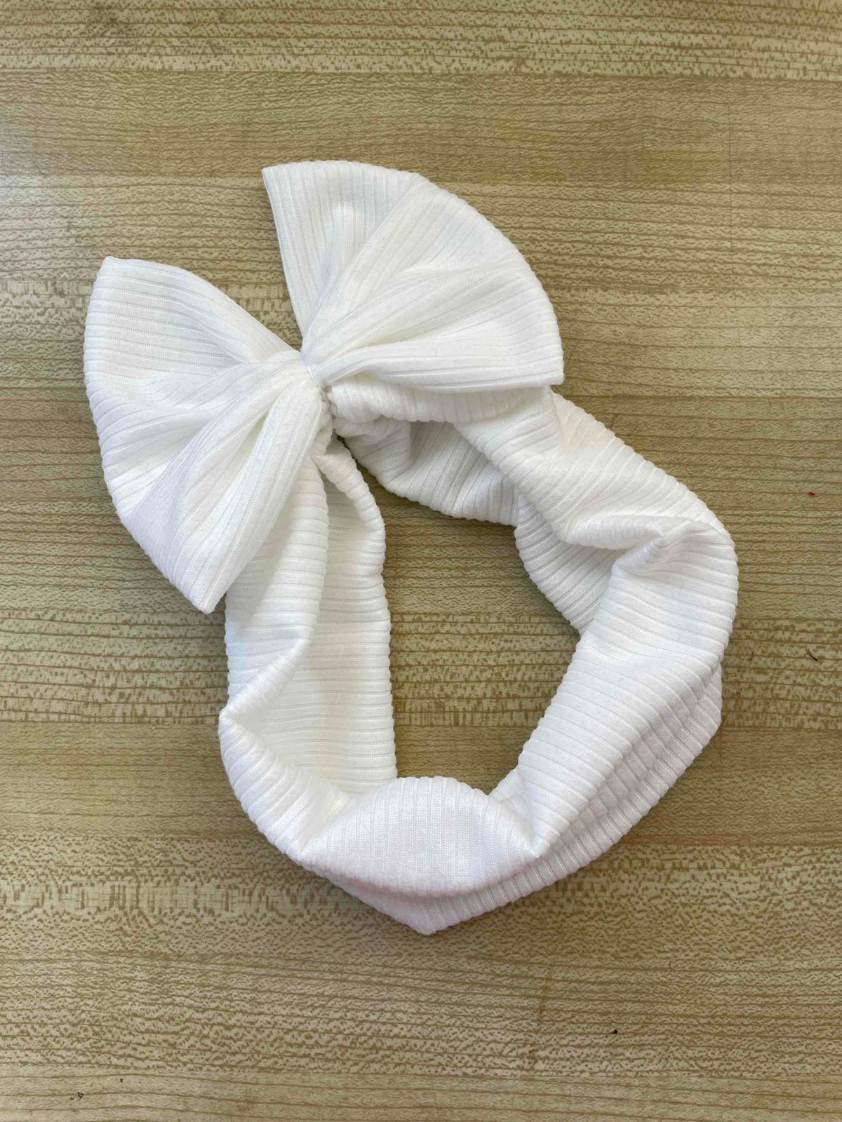 Cintillo de bebé blanco con lazo, foto 2 de 2