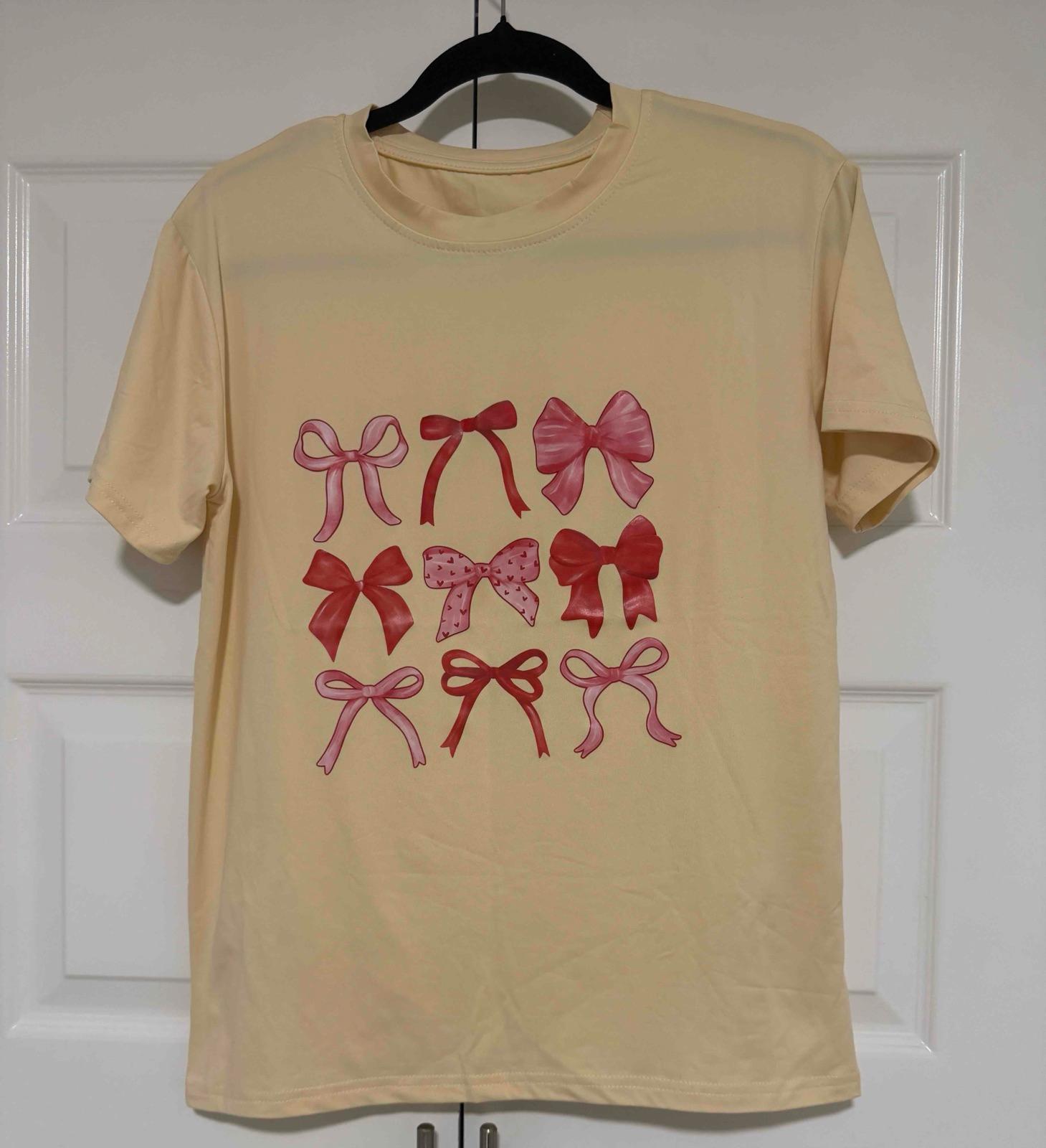 Camisa de mujer amarilla con estampado de lazos, foto 1 de 2