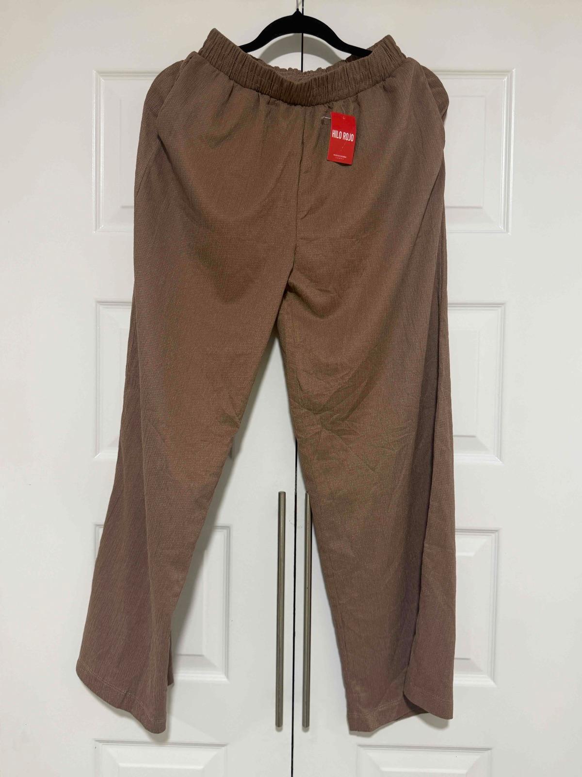 Pantalón marrón de mujer con etiqueta, foto 1 de 3