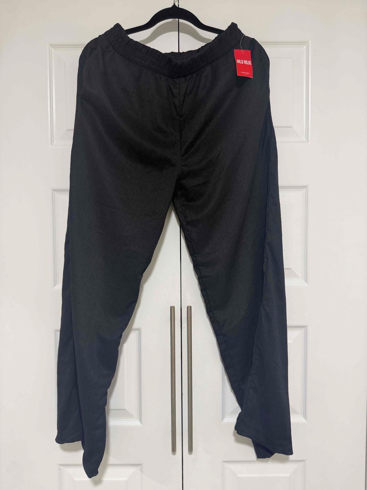 Pantalon negro de hombre, foto 1 de 3