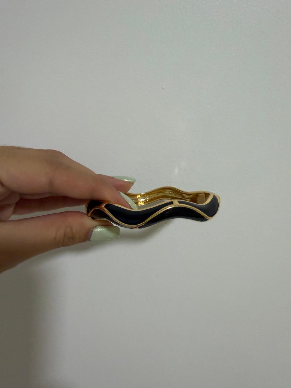 Brazalete rígido dorado y negro, foto 1 de 3