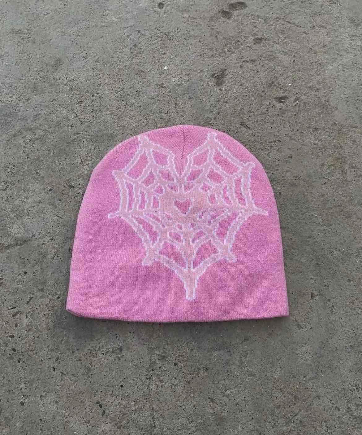 Gorro tejido color rosado con diseño de telaraña, foto 1 de 1