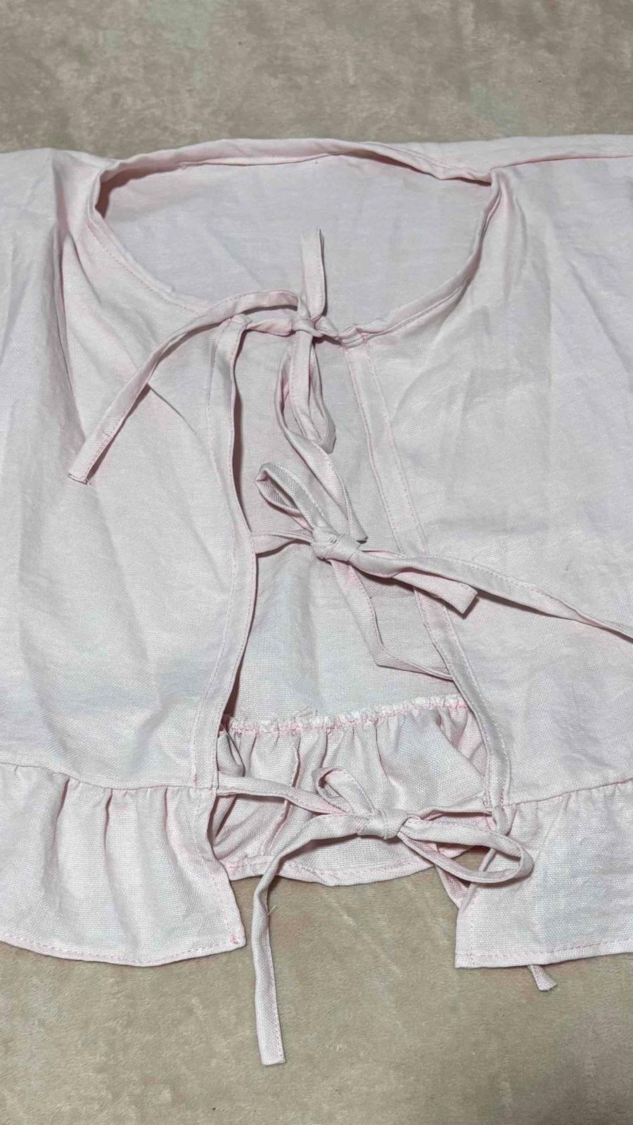 Blusa rosada sin mangas con lazos frontales, foto 2 de 2