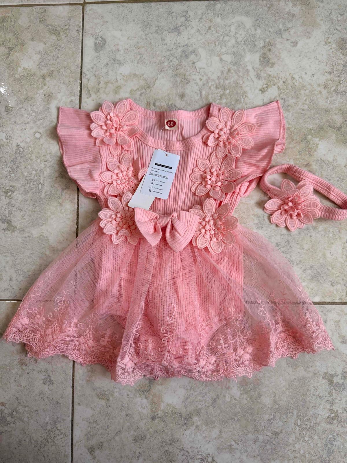 Vestido enterizo con cintillo rosado para bebé, foto 2 de 4