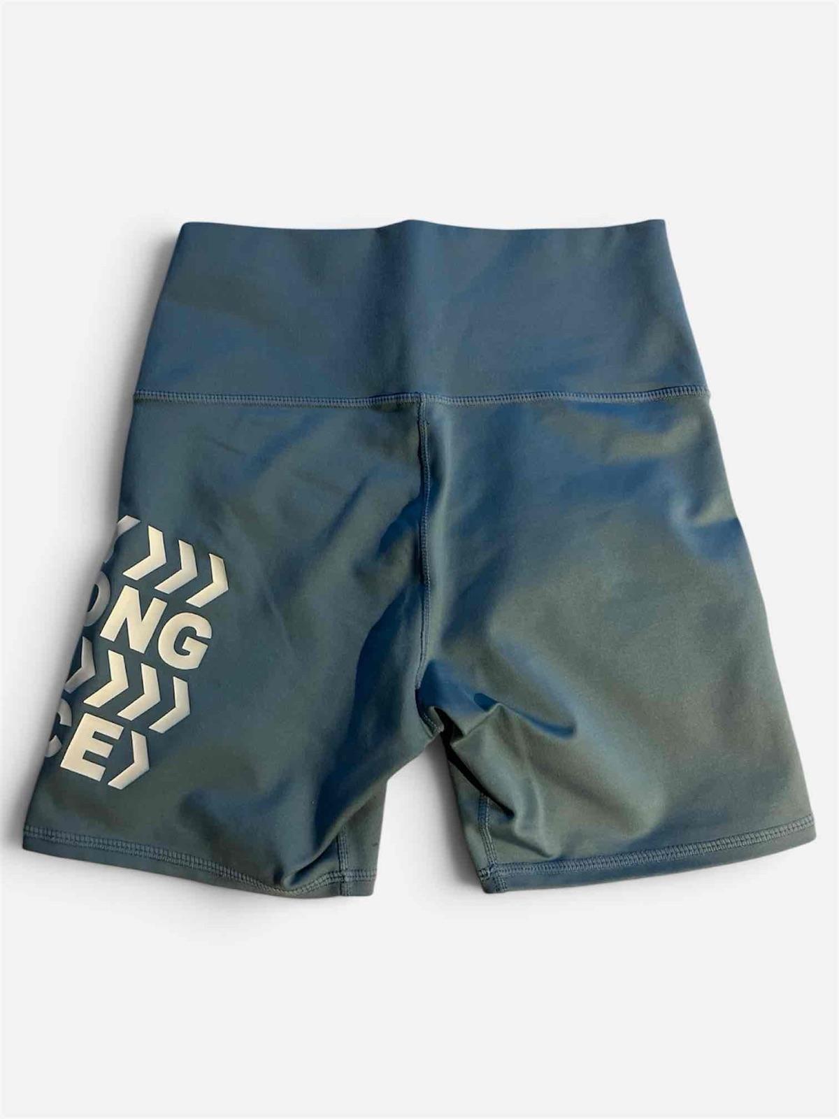 Short deportivo azul con texto, foto 2 de 2