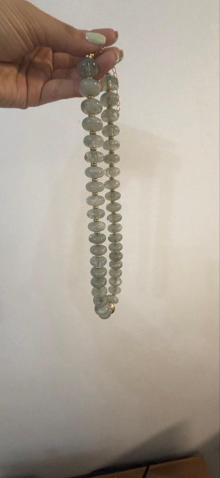 Juego de collar con cuentas y zarcillos dorados, foto 4 de 6