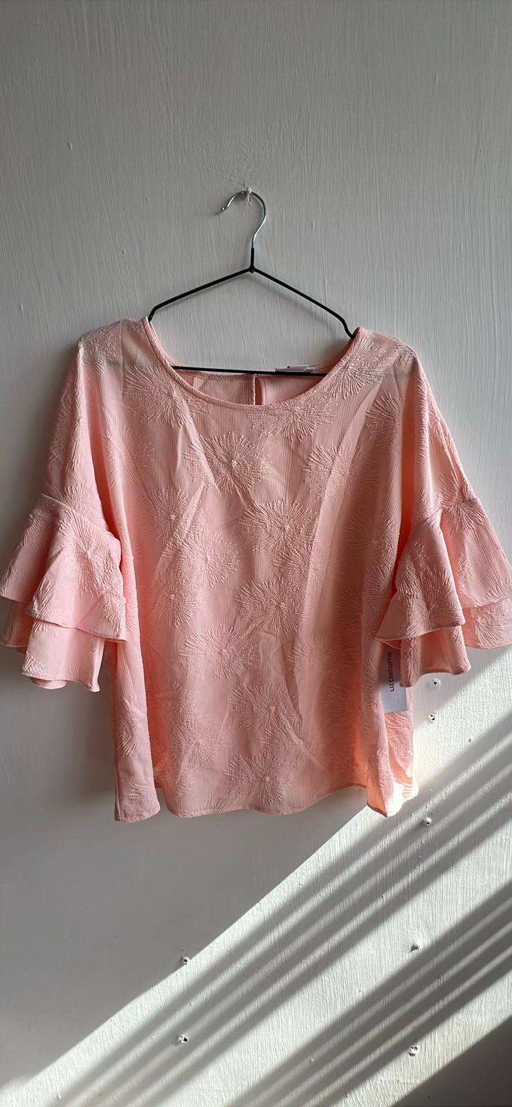 Blusa rosada con mangas con volantes, foto 1 de 1