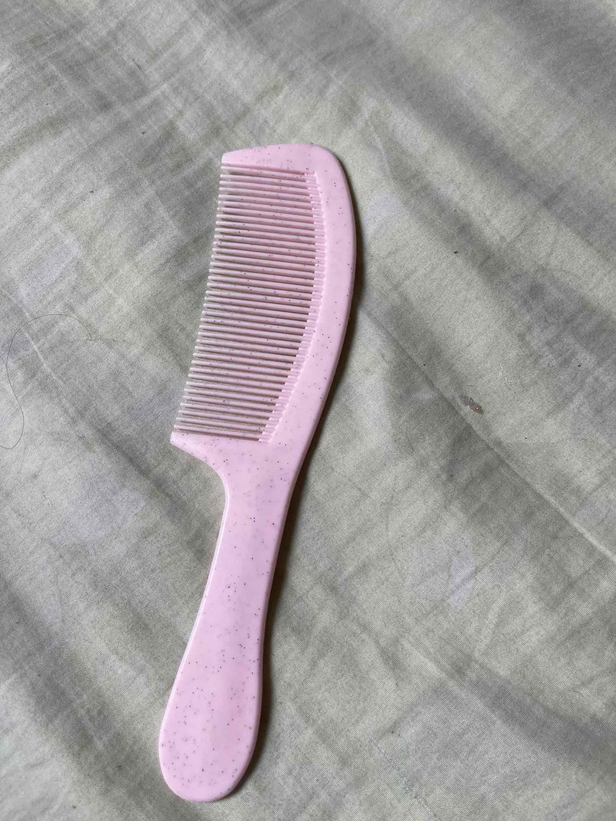 Peineta de plástico rosa, foto 1 de 1