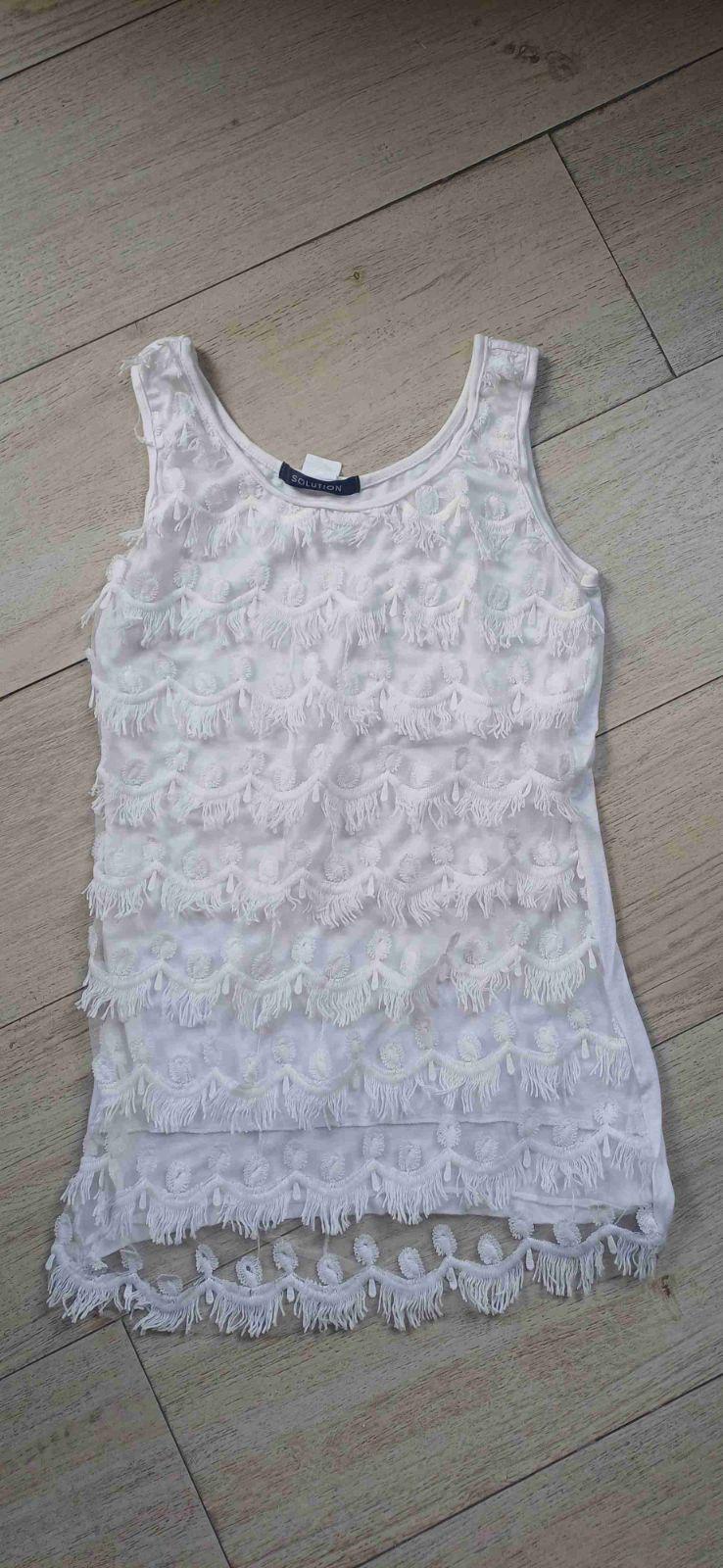 Blusa blanca sin mangas con flecos, foto 2 de 2